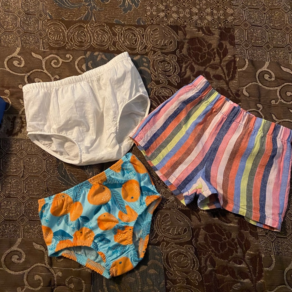 Lot of three baby girl bottoms. Two cute diaper covers and one pair of shorts.